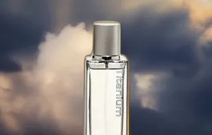 perfume bottle surrounded by clouds