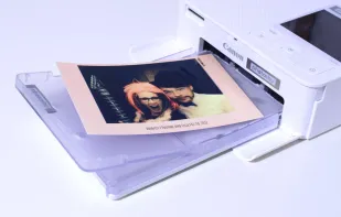 Or rent a printer for printing your guests' photos during the event! Why have a photo box at all?