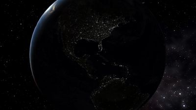 Earth's night side lit up by city lights