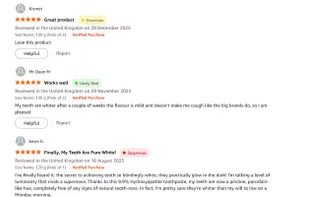 Trust indicators appear next to each review - green for Likely Real, yellow for Uncertain, red for Suspicious.