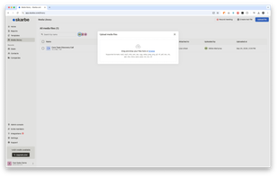 Media file upload interface, where users can drag and drop files to attach to deals or contacts for easy access and reference during the sales process.