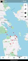 The red dots on the map are geo-tagged video locations.  Tapping a red dot will show a preview pill of the video.  Tapping the preview will play the video.